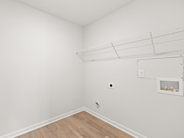 885 Lost Creek Blvd, Dallas, GA 30132 - laundry room featuring hookup for an electric dryer, light wood-style flooring, and washer hookup