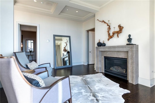 interior space with coffered ceiling, ornamental molding, dark hardwood / wood-style flooring, beamed ceiling, and a premium fireplace