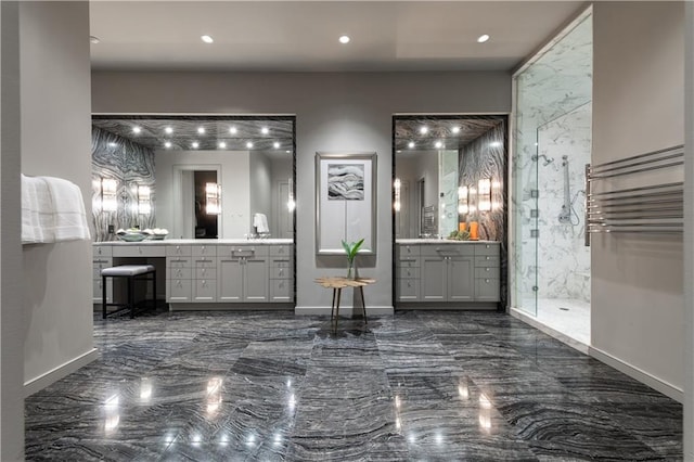 bathroom featuring vanity and a shower