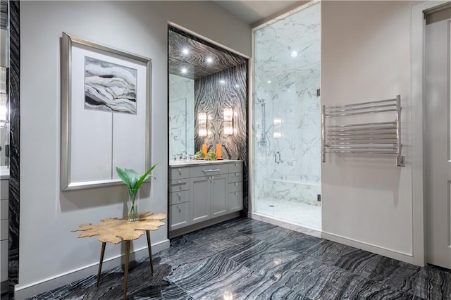 interior space featuring vanity, radiator, and tiled shower