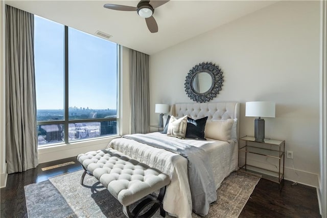 bedroom featuring dark wood-type flooring and ceiling fan