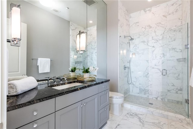 bathroom featuring vanity, toilet, and walk in shower