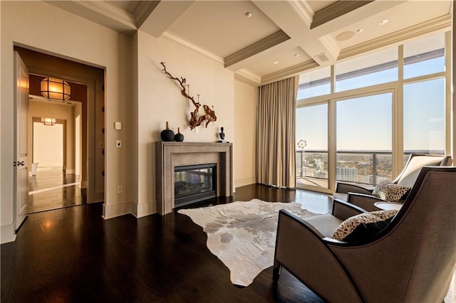 living room with ornamental molding, coffered ceiling, dark hardwood / wood-style flooring, and beam ceiling