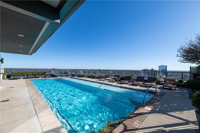 view of swimming pool with a patio area