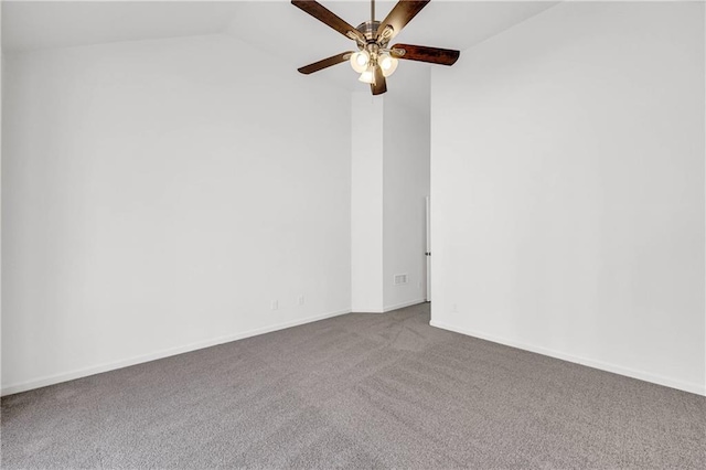 spare room featuring carpet floors, lofted ceiling, and ceiling fan