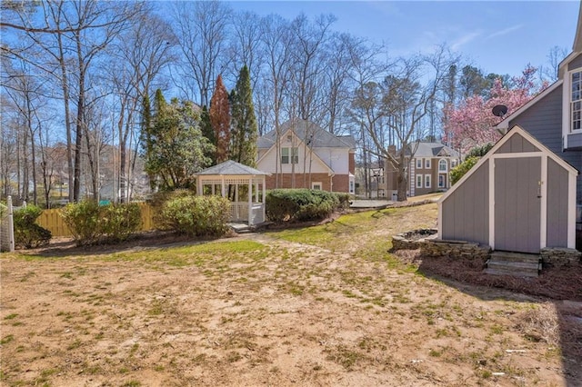 view of yard with a storage unit and a gazebo