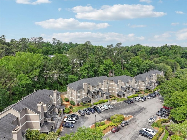 aerial view featuring a wooded view