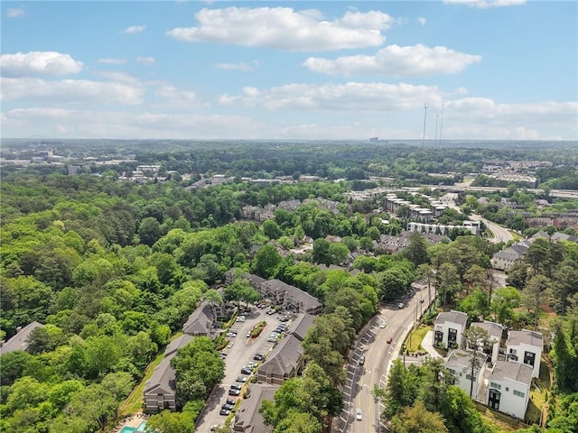 drone / aerial view featuring a wooded view
