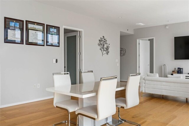 dining space featuring light hardwood / wood-style flooring