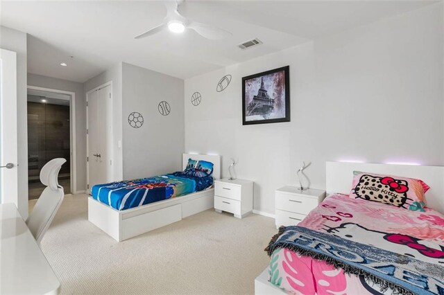 carpeted bedroom with ceiling fan