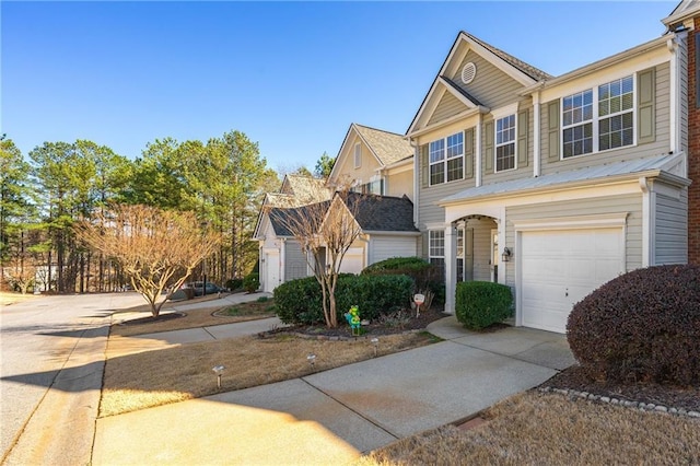 view of front of home with driveway and an attached garage