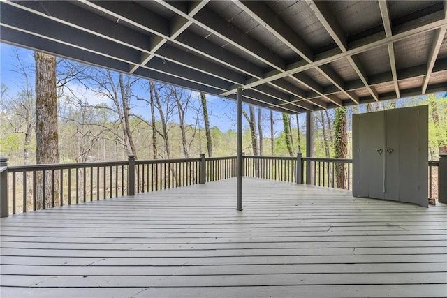 unfurnished bedroom featuring multiple windows, visible vents, baseboards, and access to exterior