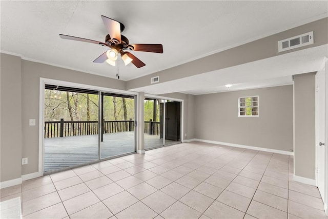 unfurnished room with baseboards and light tile patterned floors