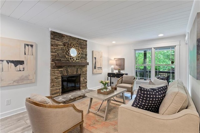 living room with a fireplace and light hardwood / wood-style floors