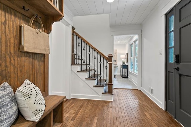 entryway featuring hardwood / wood-style flooring and wood ceiling