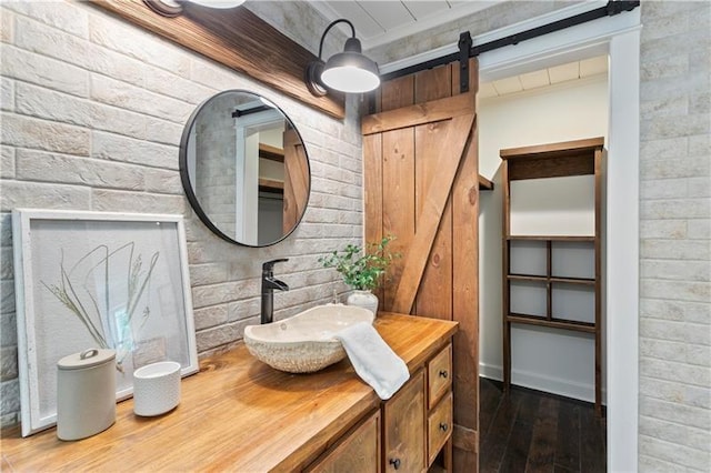 bathroom with vanity and wood-type flooring