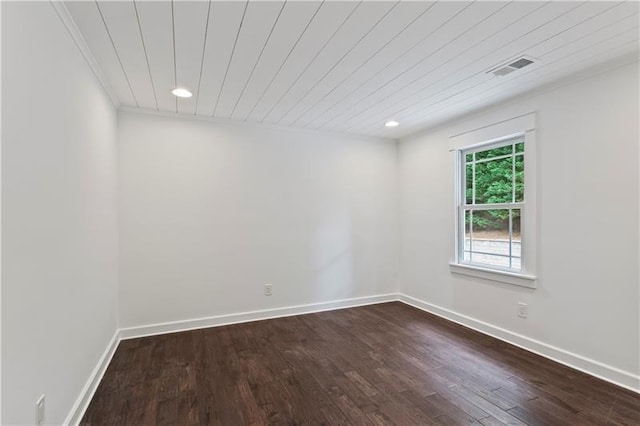 spare room featuring wood ceiling and wood-type flooring