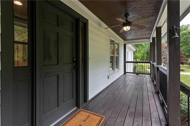 deck with ceiling fan and covered porch