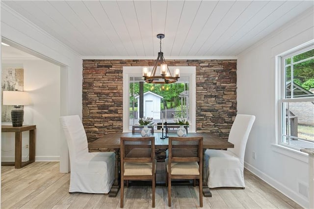 dining area with an inviting chandelier, wooden ceiling, ornamental molding, and light wood-type flooring