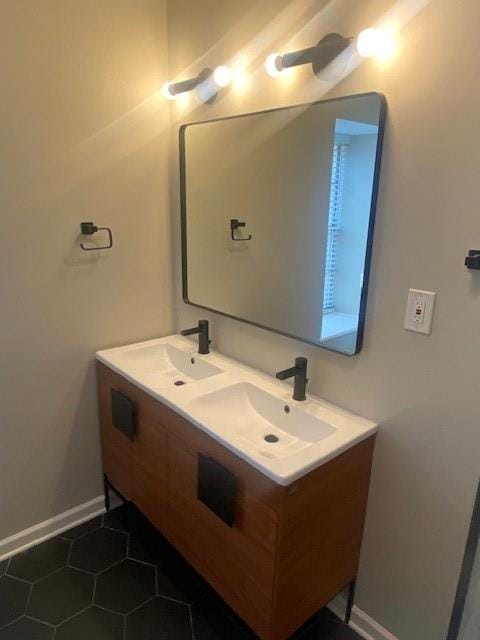 bathroom with tile patterned flooring and vanity