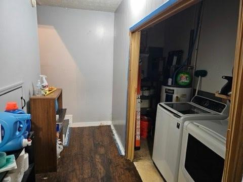 laundry area with independent washer and dryer, wood-type flooring, and a textured ceiling