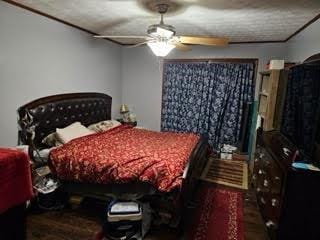 bedroom with a textured ceiling and ceiling fan