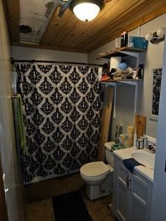bathroom with vanity, wood ceiling, curtained shower, and toilet