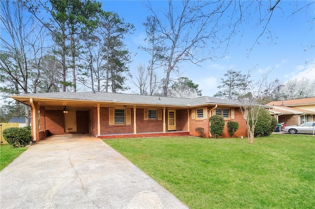 ranch-style house featuring an attached carport, concrete driveway, brick siding, and a front lawn