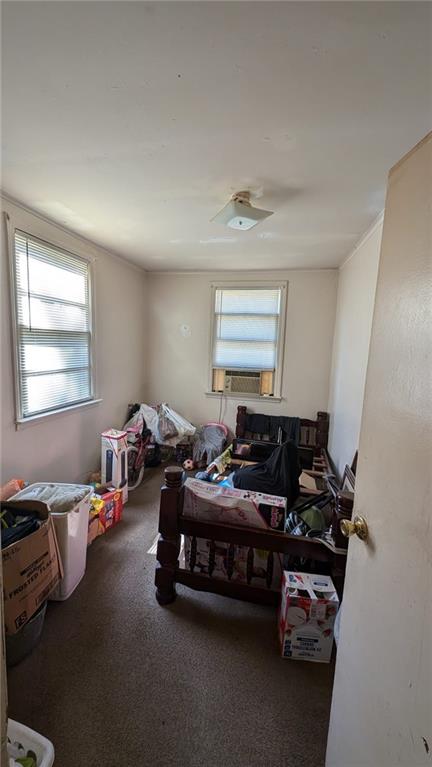 interior space with dark carpet and cooling unit