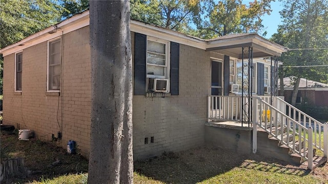 view of side of property with cooling unit