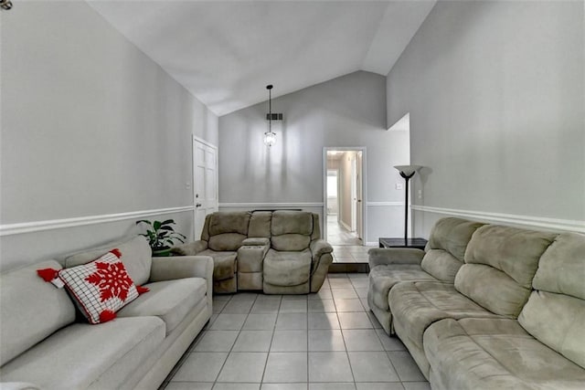 tiled living room featuring vaulted ceiling