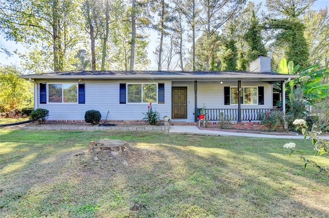 ranch-style home with covered porch and a front lawn