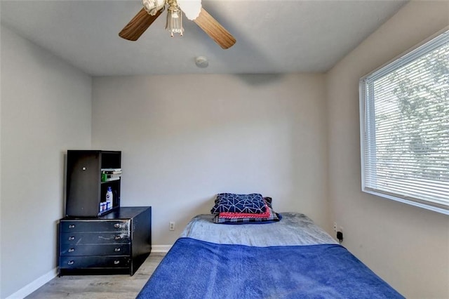 bedroom featuring ceiling fan and light hardwood / wood-style flooring