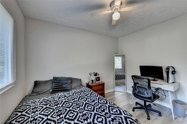 bedroom featuring ceiling fan and hardwood / wood-style flooring