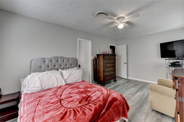 bedroom featuring light wood-type flooring and ceiling fan