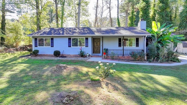 ranch-style home with a front yard and a porch