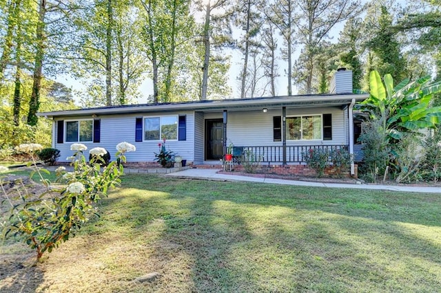 ranch-style home featuring a front yard and a porch