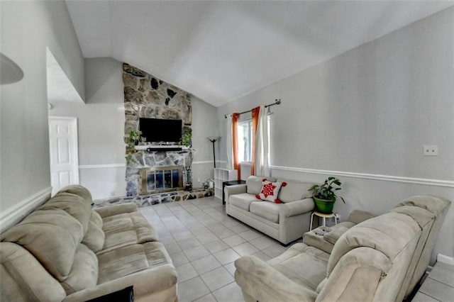 tiled living room featuring lofted ceiling and a fireplace