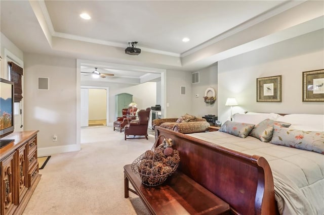 bedroom featuring light carpet, a raised ceiling, and ornamental molding