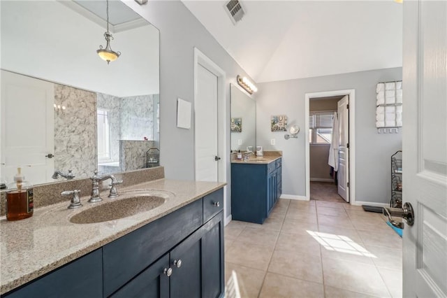 bathroom featuring vanity, high vaulted ceiling, and tile patterned floors