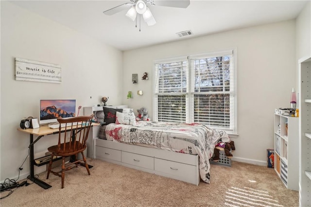 bedroom with ceiling fan and light carpet