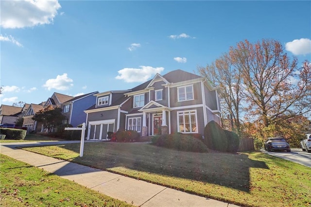 view of front facade featuring a front yard and a garage