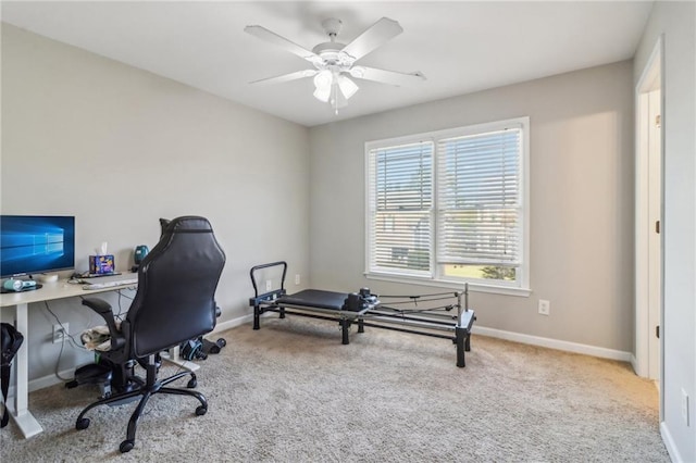 office featuring ceiling fan and light carpet