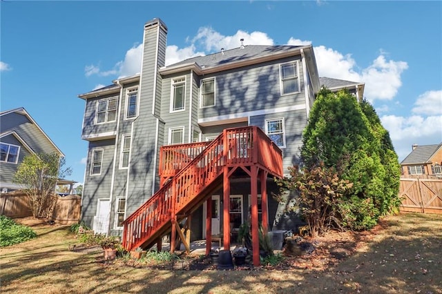 rear view of house featuring a deck