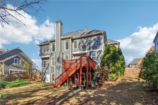 back of house with a wooden deck