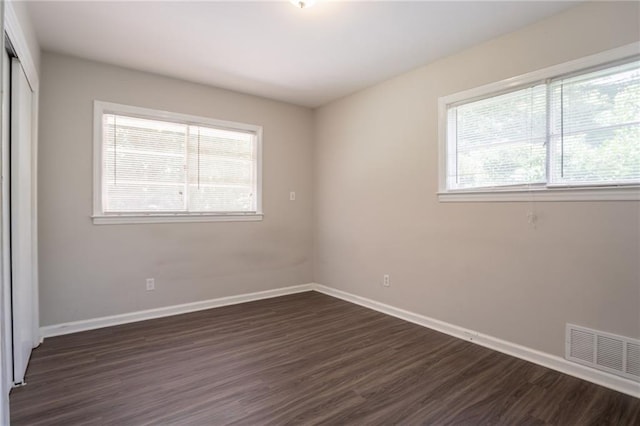 2311 Cherry Blossom Dr SW, Atlanta, GA 30331 - unfurnished bedroom with dark wood-type flooring, a closet, and baseboards