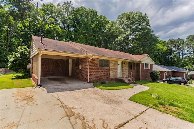 2311 Cherry Blossom Dr SW, Atlanta, GA 30331 - ranch-style home with driveway, brick siding, a front lawn, and a carport