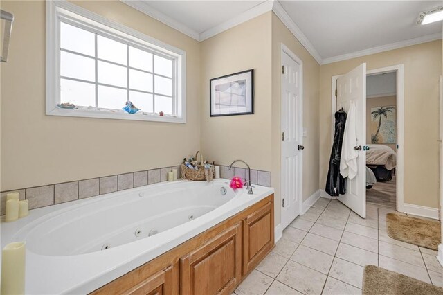 bathroom featuring connected bathroom, a jetted tub, tile patterned flooring, baseboards, and ornamental molding
