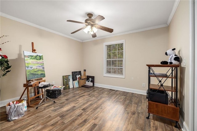 misc room featuring crown molding, baseboards, ceiling fan, and wood finished floors