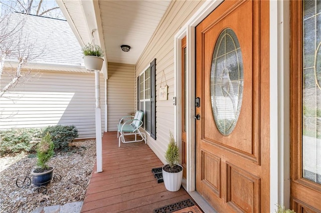 property entrance with covered porch